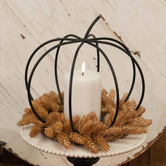 a white candle sitting on top of a table