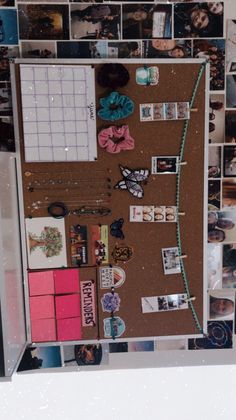 an overhead view of a bulletin board with pictures and magnets all over it,