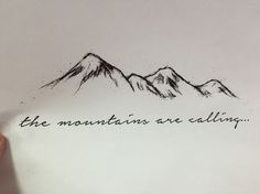 the mountains are calling written on a piece of paper