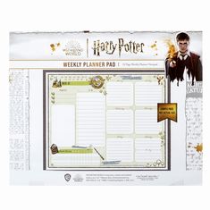 the harry potter weekly planner pad is shown in front of a white background with gold accents