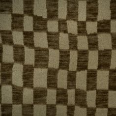 a brown and white checkerboard pattern on fabric