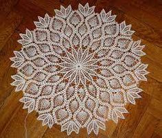 a white doily is laying on the floor