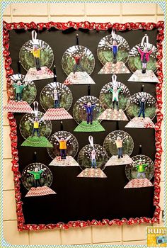 a snow globe activity is displayed on a bulletin board with red and green trimmings