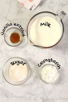 ingredients to make vanilla extra butter and sugar cookies on a marble counter top with the words milk, sugar, baking mix in small glass bowls