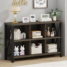 a shelf with books and stuffed animals on it