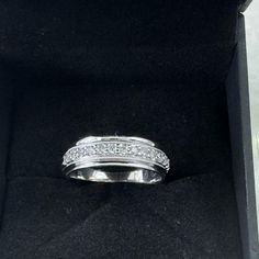 a white gold ring with diamonds in it