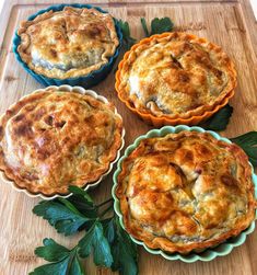 three pies sitting on top of a wooden cutting board