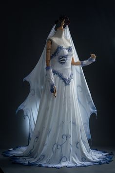 a white and blue wedding gown on display