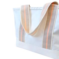 Product Details: This Cabana tote is the ultimate beach bag sun-seeker. With its spacious interior, this tote is perfect for carrying all your beach or pool essentials, from towels and sunscreen to snacks and drinks. This bag is durable and made of a waterproof fabrication. We think this bag changes the beach game. It is so chic, yet so useful. Dimensions 12.5”H x 21.5” W x 8”D Handle Drop 11" Made from 18.5oz tear and water-proof vinyl-coated nylon. Pool Essentials, Beach Games, Mini Moderns, Wine Tote, Hats For Sale, Beach Pool, Water Proof, Clutch Purse, Beach Bag