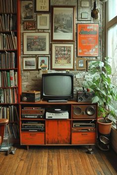 an old television sitting on top of a wooden entertainment center