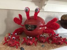 a group of red crabs sitting on top of a counter