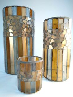 two vases made out of mosaic tiles