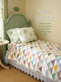 there is a bed that has some pillows on it and the words sweet dreams above it