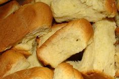 closeup of freshly baked bread rolls piled on top of each other