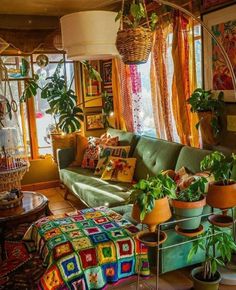 a living room filled with lots of potted plants