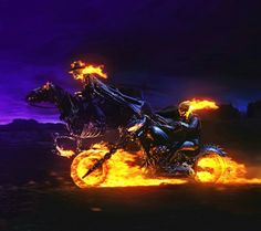 a man riding on the back of a motorcycle covered in flames