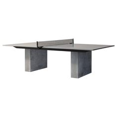 the ping pong table is made out of concrete and has a steel frame on top