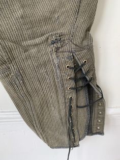 an old pair of pants with laces on them