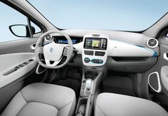 the interior of a car with dashboard, steering wheel and infotains on display