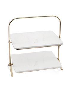 two tiered white marble trays with gold metal handles, one on each side