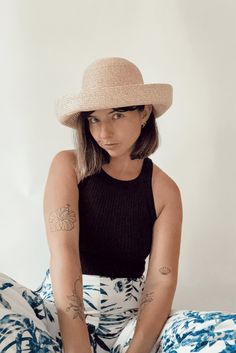 Whether you're attending rowing regattas, enjoying summer picnics, or leisurely drifting down the river, our woven raffia straw hat is the perfect companion. Featuring a timeless dome boater style with a charming flipped edge, it effortlessly combines elegance with a laid-back vibe. This is the epitome of the relaxed yet refined look we're all embracing this year. COUTONIC VINTAGE COLLECTION The COUTONIC Vintage Collection is not just a fashion collection; it's a sustainability-conscious homage Curved Brim Boater Hat For Beach Season Picnic, Curved Brim Boater Hat For Beach Picnic, Flat Brim Straw Hat For Beach Season Picnic, Flat Brim Straw Hat For Picnic During Beach Season, Spring Coastal Boater Hat Made Of Toquilla Straw, Summer Wide Brim Boater Hat For Picnic, Summer Hats For Picnic With Short Brim, Spring Wide Brim Boater Hat In Paper Straw, Summer Hat With Short Brim For Picnic