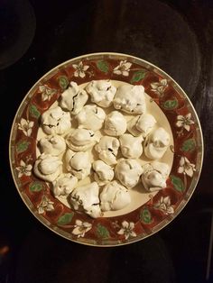 a plate filled with marshmallows on top of a table