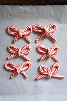 several candy canes tied together in the shape of bows