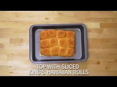 a metal tray topped with sliced oranges on top of a wooden table