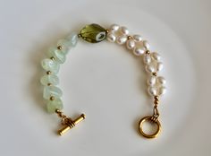 Beautiful jade and freshwater pearl beaded bracelet with toggle closure, good for both daily life and formal occasions. Looks expensive.  Usually ships within 1-2 business days,.  Thanks for purchasing. Pearl Bracelet With Natural Stones For Wedding, Wedding Pearl Bracelet With Natural Stones, Elegant Jade Beaded Bracelets For Gift, Elegant Pearl Bracelet With Gemstone Beads, Elegant Pearl Bracelet With Natural Stones For Wedding, Elegant Jade Gemstone Beaded Bracelets, Elegant Jade Bracelets For Wedding, Elegant Jade Pearl Bracelet For Gift, Elegant Green Beaded Bracelets For Formal Occasions