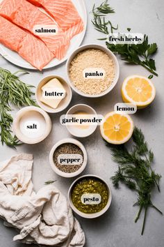 ingredients to make salmon fillets laid out on a table with their names in small bowls