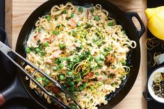 a skillet filled with pasta and peas