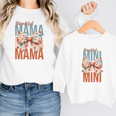 These adorable matching mommy and me sweatshirts are perfect for Fall! Available in multiple sizes and shirt styles to fit toddlers, babies, and of course mom! The sweatshirts, t-shirts, and baby bodysuits are all made of soft, high-quality fabric to keep everyone comfy and cozy this fall! How to Order Your Matching Shirts: 1) Select the first size (for either Mom or Child) from the dropdown menu. Click "Add to Cart". 2) Go back to the listing, select the second size (for the second person), and click "Add to Cart" again. 3) Repeat for as many sizes as you would like.  4) Once all the desired sizes are added to your cart, proceed to checkout! SHIRT INFORMATION & SIZING: The crewneck sweatshirt and hoodie options are Gildan Heavy Blend sweatshirts made from a blend of 50% cotton and 50% pol Cute Long Sleeve Custom Print T-shirt, Family Long Sleeve T-shirt For Mother's Day, Long Sleeve T-shirt For Mother's Day Family Event, Long Sleeve T-shirt For Mother's Day, White Long Sleeve Matching T-shirt, Casual Mother's Day Sweatshirt For Family, Family Matching Long Sleeve Custom Print T-shirt, Casual Sweatshirt For Mother's Day Family Gathering, Casual Sweatshirt For Mother's Day Family Event