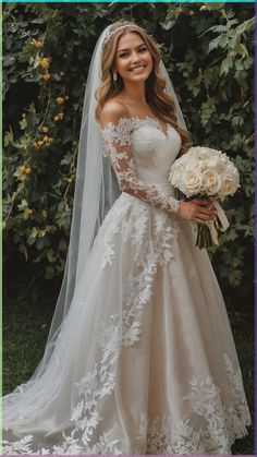 a woman in a wedding dress holding a bouquet and smiling at the camera with greenery behind her