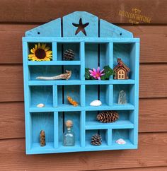 a blue shelf filled with lots of different items