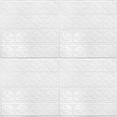 a white tiled wall with small squares on it