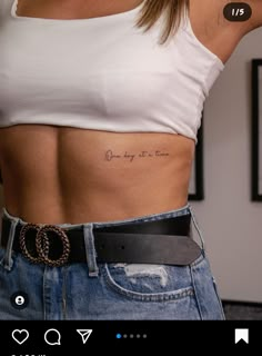 a woman's stomach with the words one day at a time written on it