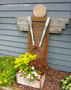 a chair made out of wood and some flowers