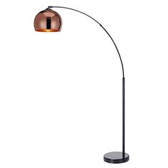 a floor lamp with a metal base and a copper colored shade on the light bulb