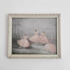 three ballerinas in pink tutu skirts are dancing