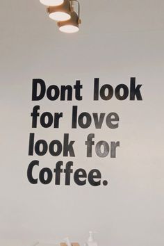 a coffee shop advertisement with don't look for love, look for coffee on the wall