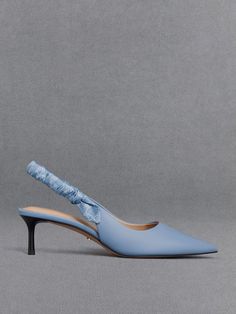 This item is part of our Online Exclusive selection, which consists of unique colourways and designs that are only available for purchase at CHARLESKEITH.COM.A coloured accent can change up your look - this tasteful pair will put a bright spot on any look. The light blue finish is subtle yet eye-catching, and softens the pointed-toed silhouette for a feminine look. As a distinctive touch, the ruched slingback straps feature the brand’s monogram print for a visually interesting detail. Set Light Blue Kitten Heels, Blue Kitten Heels, Charles And Keith Shoes, Online Shopping Shoes, S Monogram, Charles Keith, Monogram Prints, Feminine Look, Slingback Pump