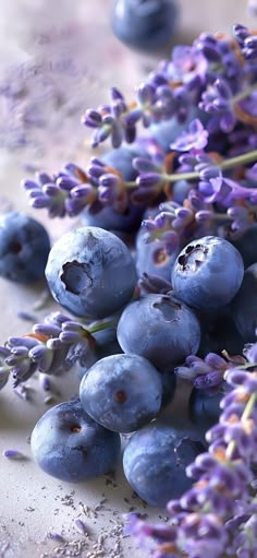 some blueberries and lavender flowers on a table