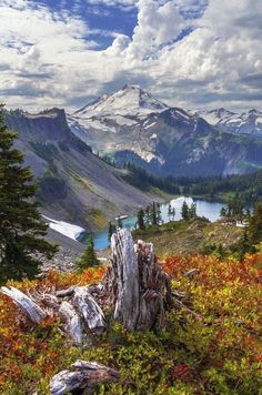 a view of the mountains and lake from an overlook point on top of a mountain