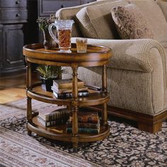 a living room scene with focus on the couch and coffee table in the centerpiece