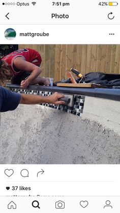 two people working on a skateboard ramp