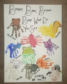 a child's handprinted poster with different animals and words written on it