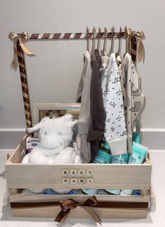 a baby hamper filled with clothes and toys