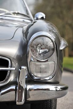 an old car is parked on the side of the road in black and white photo