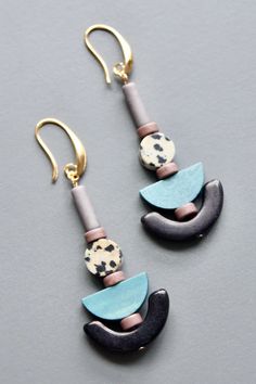 18k gold plated brass hooks with gray magnesite, dalmatian jasper, painted wood, and black magnesite. Each half pair weighs .16 oz and measures 2.875 inches. Wood And Black, Beaded Jewelry Necklaces, Dalmatian Jasper, Painted Wood, Dalmatian