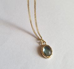 This minimalist Blue Topaz solid gold necklace was designed with a light blue December birthstone pendant, to beautifully accompany you through your busy days. The classic simple design is always pretty for day and evening, work or fun. The gold Blue Topaz necklace is handmade and delicate and available both with a 9kt or 14 karat pendant. The gold chain is made of 14k and available in a couple lengths and in different chain types A, B or C. Please note which one you prefer. The clear Blue topaz Gift Gold Necklace With Blue Topaz, Blue Topaz Oval Pendant Necklace As Gift, Blue Topaz Oval Pendant Necklace For Gift, Gold Necklace With Blue Topaz Birthstone, Gold Blue Topaz Birthstone Necklace As Gift, Gold Blue Topaz Birthstone Necklace For Gift, Yellow Gold Necklace With Blue Topaz Birthstone, Gold Birthstone Necklace With Blue Topaz For Gifts, Blue Topaz Oval Pendant Necklace With Birthstone